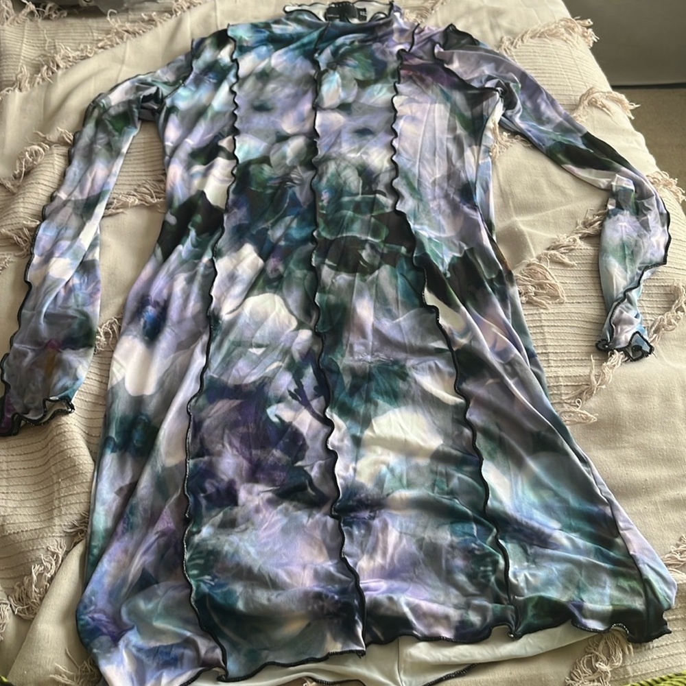 Beautiful floral print body on dress. Slightly see through.